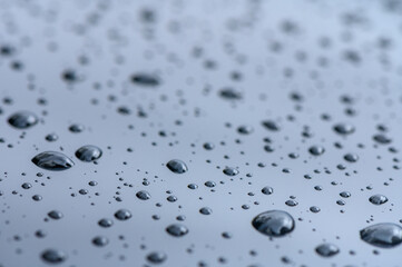 Raindrops on the surface of the car glass. Raindrops natural abstract background.