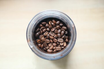 Top view of a cup with coffee beans