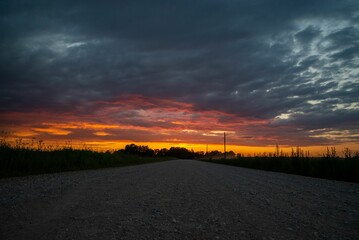 View of a sunset in the field and road