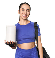 Fitness young Caucasian woman with protein and bag on studio background happy, smiling and cheerful.