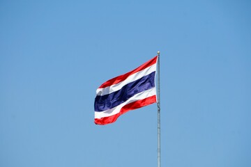 Flag of Thailand against blue sky