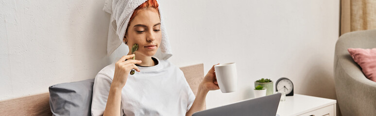 beautiful queer person with hair towel and face roller drinking tea while watching movies, banner