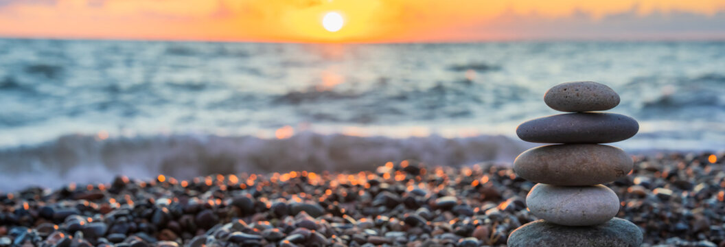 Stones stacked on top of each other on the seashore, harmony, balance
