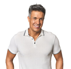 Confident middle-aged Hispanic man posing stylishly in studio