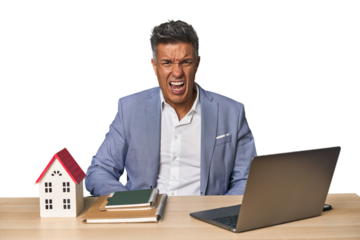 Middle-aged Hispanic businessman with real estate theme screaming very angry and aggressive.