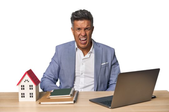 Middle-aged Hispanic businessman with real estate theme screaming very angry and aggressive.