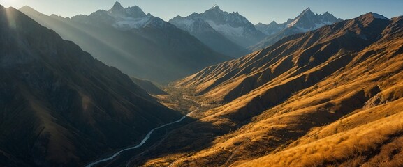 an aerial shot of mountains in the afternoon with the sun shining through them - obrazy, fototapety, plakaty