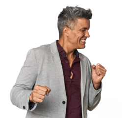 Middle-aged Latino man dancing and having fun.