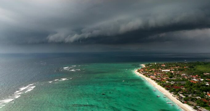 Storm Clouds Over The Seascape And Coastal Village In Nusa Lembongan Island In Bali, Indonesia. - aerial shot