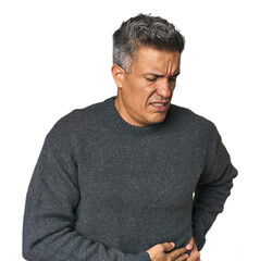Middle-aged Latino man having a liver pain, stomach ache.