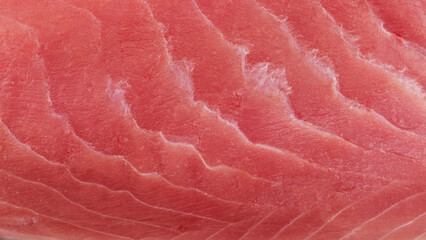 Macro shot yellow fin tuna steak background. Fresh rare steak close up. Raw yellowfin tuna fillet texture. Background fresh tuna meat. Slices of tuna meat