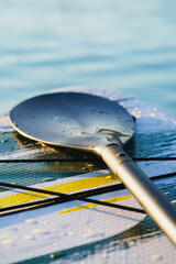 Close up of a Stand Up Paddle surf board or SUP on the water.