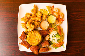 Mashed plantains and fried pork, chicken and shrimp