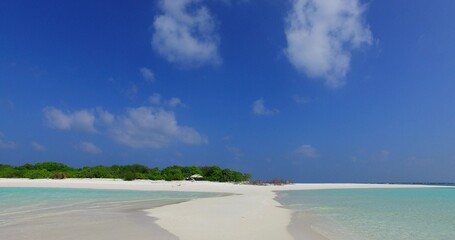 Untouched sandy island washed by the ocean in Southeast Asia