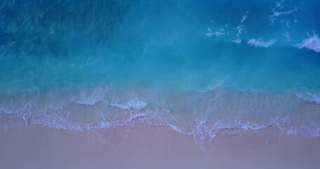 Aerial drone shot of the beautiful Indian Ocean and the sandy beach in the Maldives