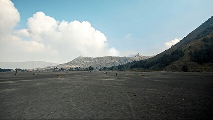 The steaming active volcano crater of the Bromo on the Java island