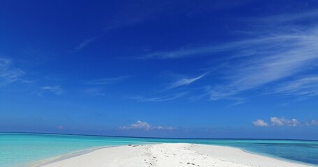 White sandy beach with turquoise water in an island