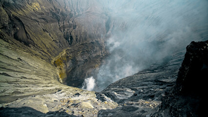 The steaming active volcano crater of the Bromo on the Java island