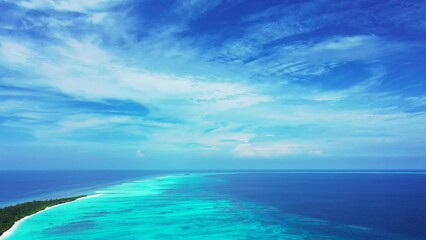 Aerial view of magical blue ocean on a sunny summer day