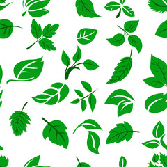 A seamless pattern featuring an array of green leaves in various shapes and sizes scattered across a white background, ideal for fabric or wallpaper.
