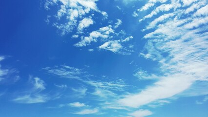 Low angle shot of a cloudy blue sky on a sunny day