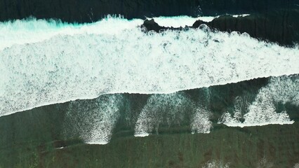 Beautiful view of a sea with foamy waves on sunny day in Asia