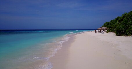 Beautiful view of people on a beach on a sunny day in Asia