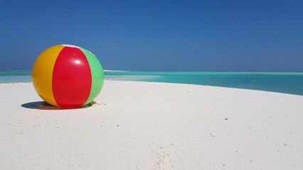 Colorful ball on a sandy beach