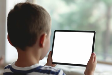 Display mockup from a shoulder angle of a boy holding a tablet with a completely white screen
