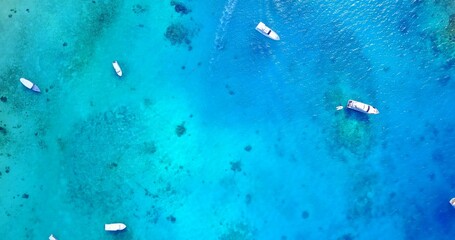 Aerial view of boats in the turquoise ocean