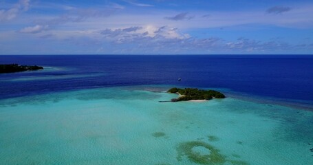 Fototapeta premium Aerial view of a small island in the Indian Ocean, the Maldives