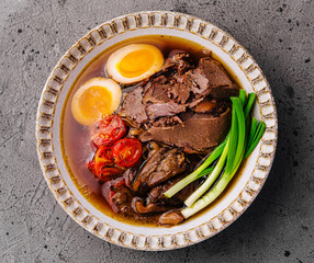 Savory beef ramen bowl with egg and vegetables