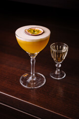Elegant passion fruit cocktail with shot glass