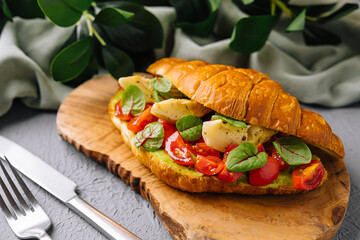 Gourmet tomato and mozzarella croissant sandwich