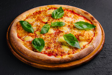 Margherita pizza on black surface