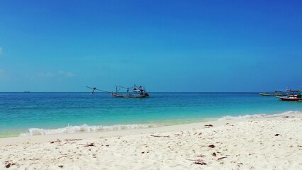 Beautiful view of a boat in the sea under a blue sky in Asia