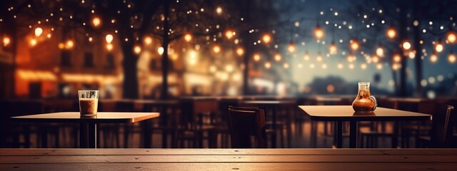 Empty outdoor restaurant and coffee shop on blurred city light background.
