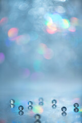 abstract, creative light, blue background with multi-colored, rainbow highlights and bokeh, with...