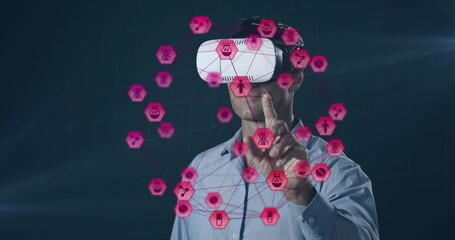 Image of network of connections with icons over man wearing vr headset and data processing