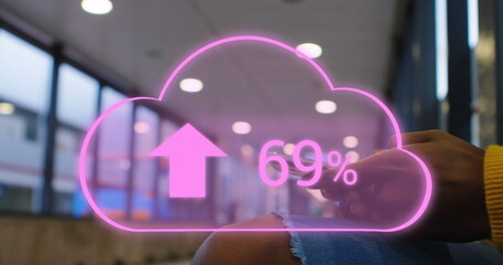 Image of cloud with arrows and percent going up over caucasian woman using smartphone