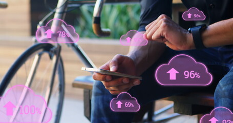 Image of clouds with arrows and percent going up over caucasian man using smartphone