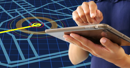 Mid section of a woman using a digital tablet against navigation map line scheme on blue background