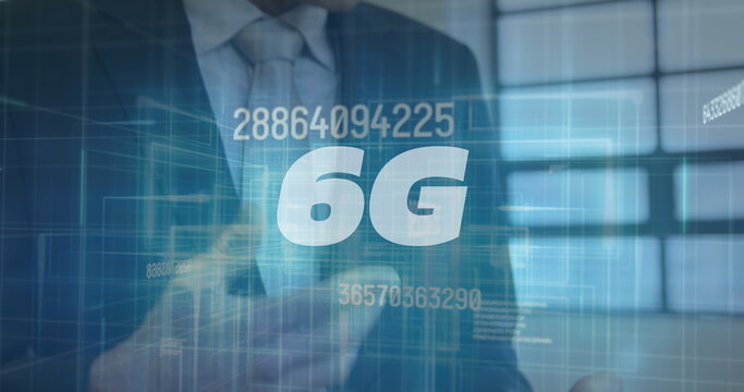 Image of 6g and numbers over caucasian businessman using tablet