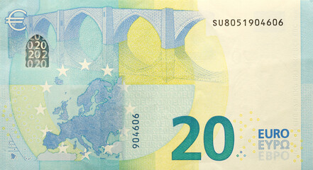 Fragment of one twenty euro money bill. Details of European union currency banknote of 20 euro close up