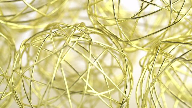 Decorative golden wire spheres, rotating. Thin golden wire ball, abstract background. Luxure background