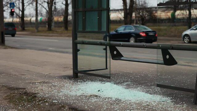 Highlight the impact of vandalism as shattered windows mar the appearance of the city's bus station, signaling the need for community action to address urban blight