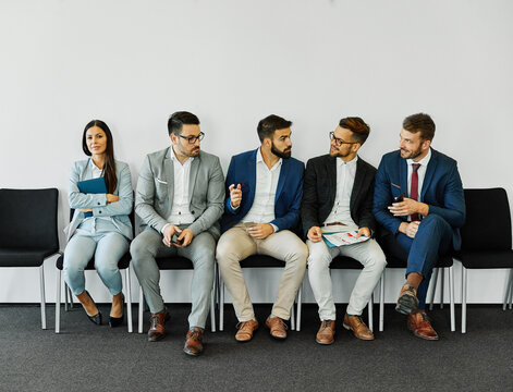 man woman businesswoman business chair sitting waiting businessman candidate recruitment office gender discrimination  job young interview workplace harassment gossip secret rumor