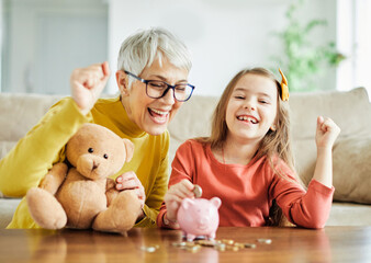 child money saving grandfmother family coin senior finance bank piggybank happy investment granddaughter girl financial elderly cash