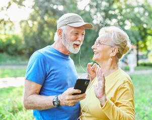woman man outdoor senior couple retirement elderly phone fitness mobile smartphone music app communication active together love old nature using internet smart mature retired vitality healthy love