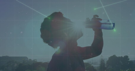 Image of network of connections over african american man drinking water